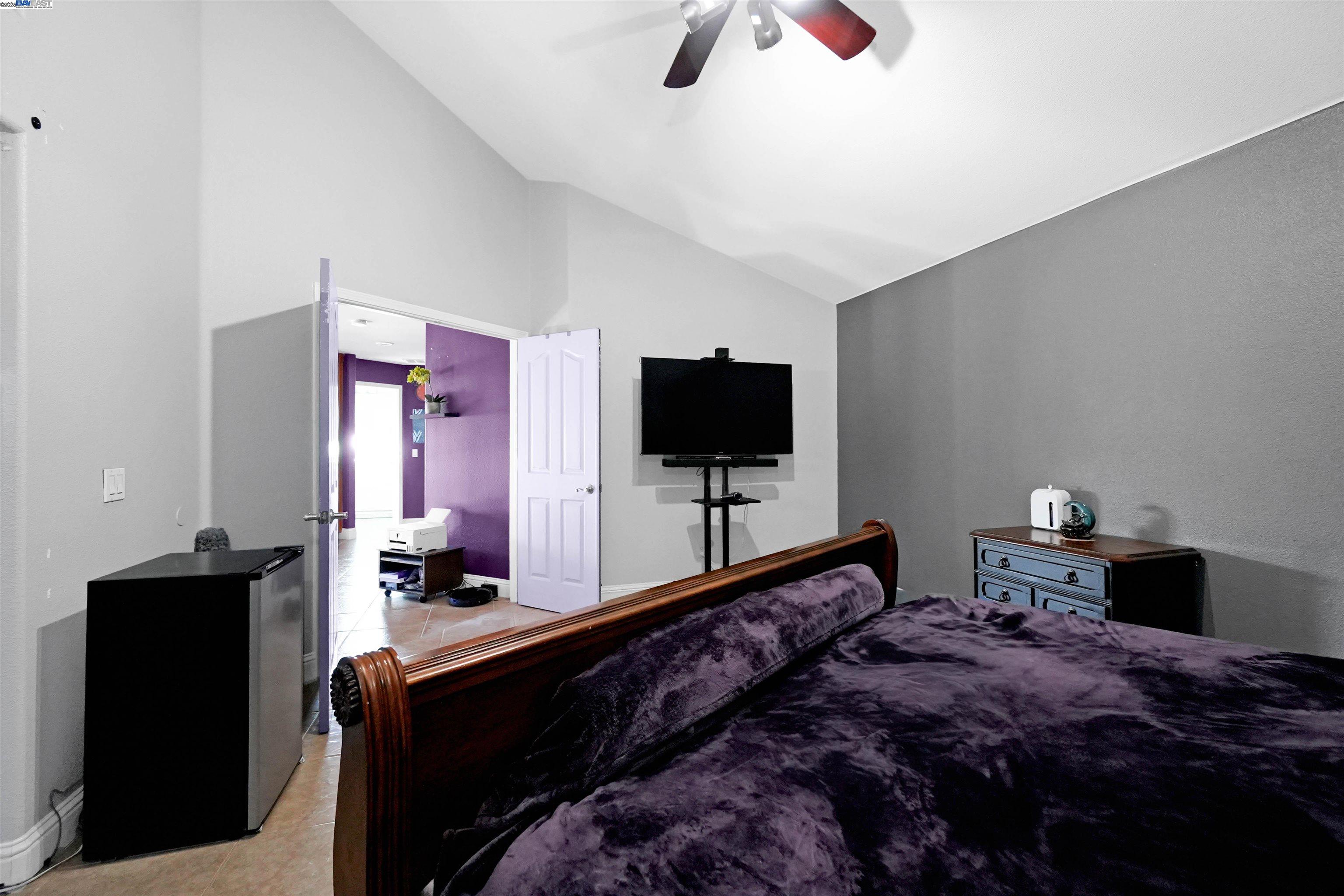 1445 Yorkshire Loop Tracy, CA 95376 - Photo 40 of 55 a bedroom with a bed and a flat screen tv