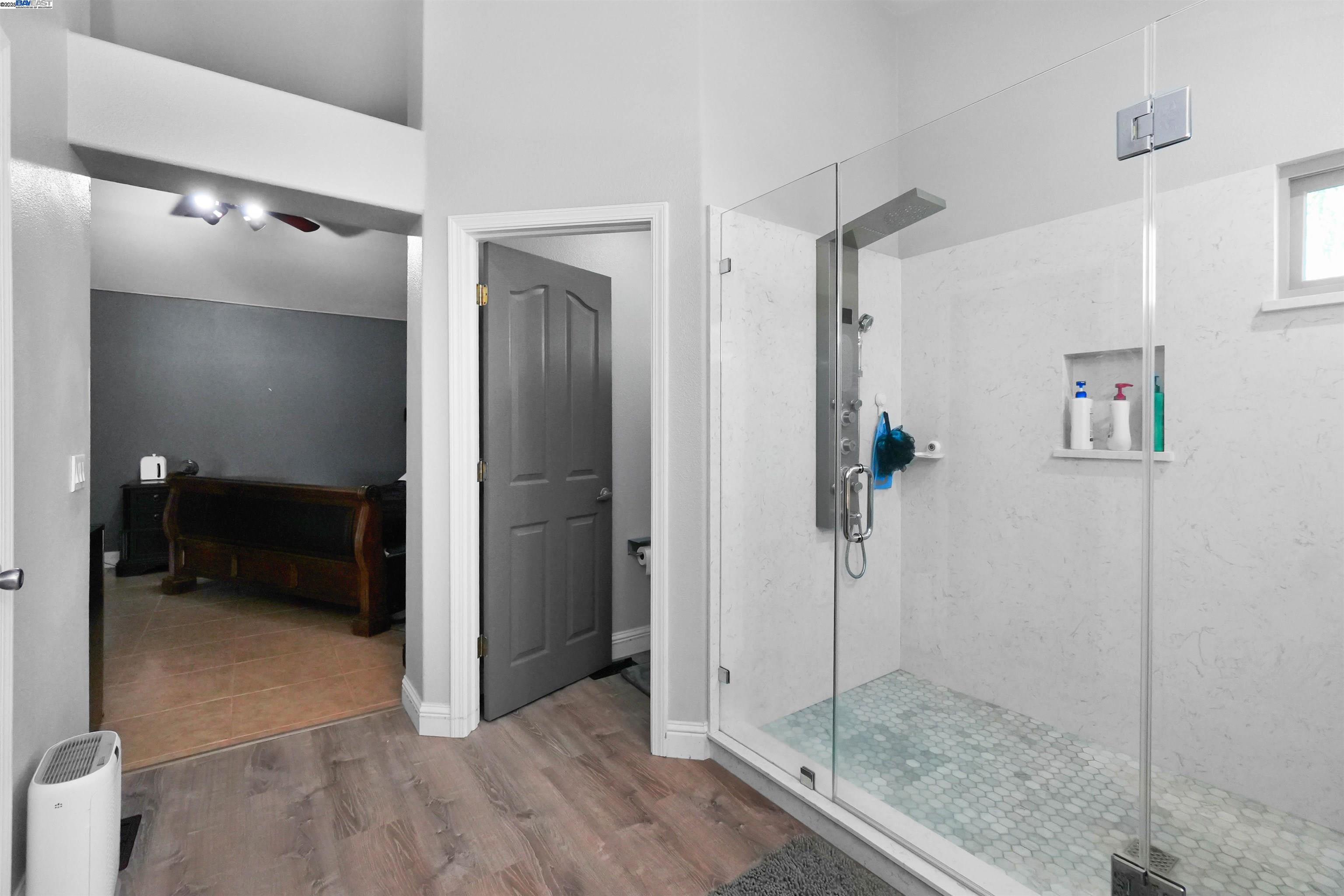 1445 Yorkshire Loop Tracy, CA 95376 - Photo 42 of 55 a view of a bathroom with a shower and a sink