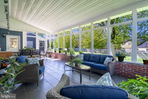 a outdoor living space with furniture and garden view