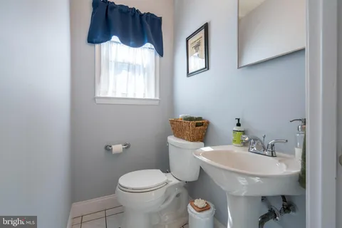 a utility room with sink dryer and washer
