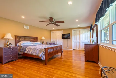 a bedroom with a bed and a couch