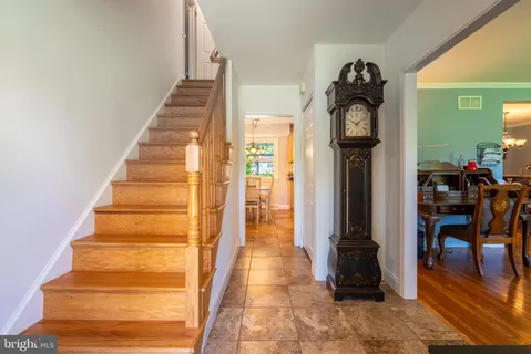 a view of an entryway with wooden floor and door