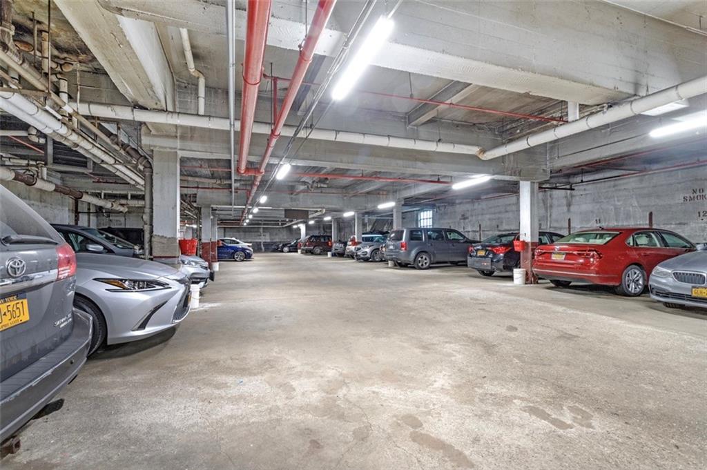 9801 Shore Road, Unit 2O Brooklyn, NY 11209 - Photo 18 of 24 a view of cars parked in a parking