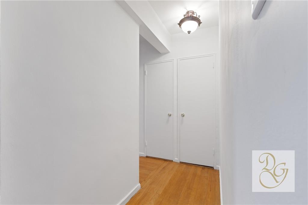 9801 Shore Road, Unit 2O Brooklyn, NY 11209 - Photo 8 of 24 a view of empty room with wooden floor