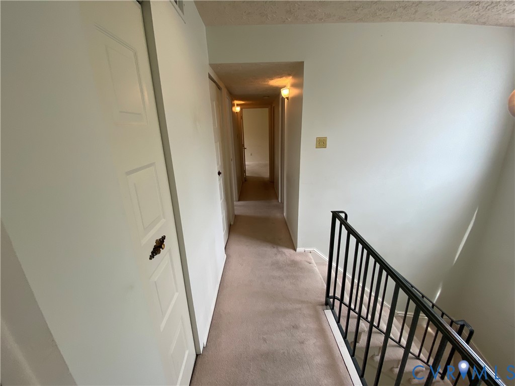 1507 Bronwyn Road, Unit 301 Henrico, VA 23238 - Photo 28 of 41 a view of a hallway with wooden floor and staircase