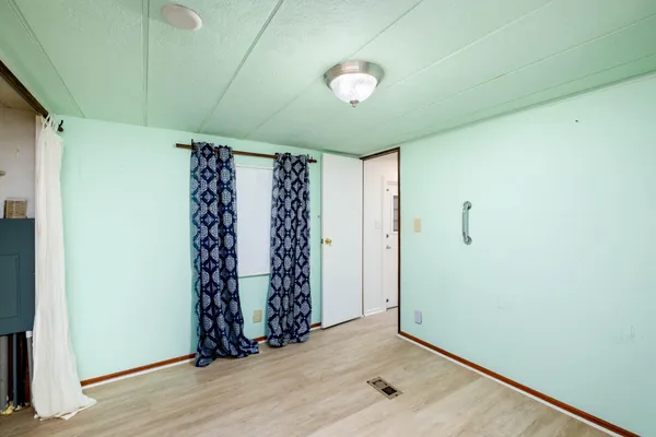 a room with a bed and a chandelier