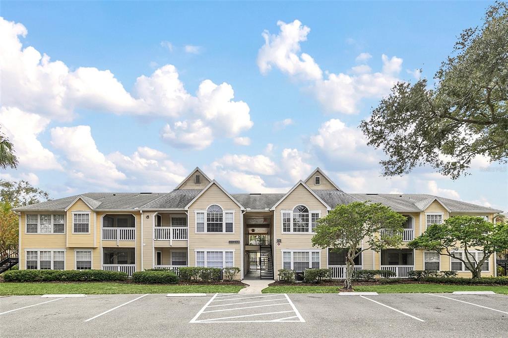 1043 South Hiawassee Road, Unit 3125 Orlando, FL 32835 - Photo 1 of 1 a view of a white building among the street with a building