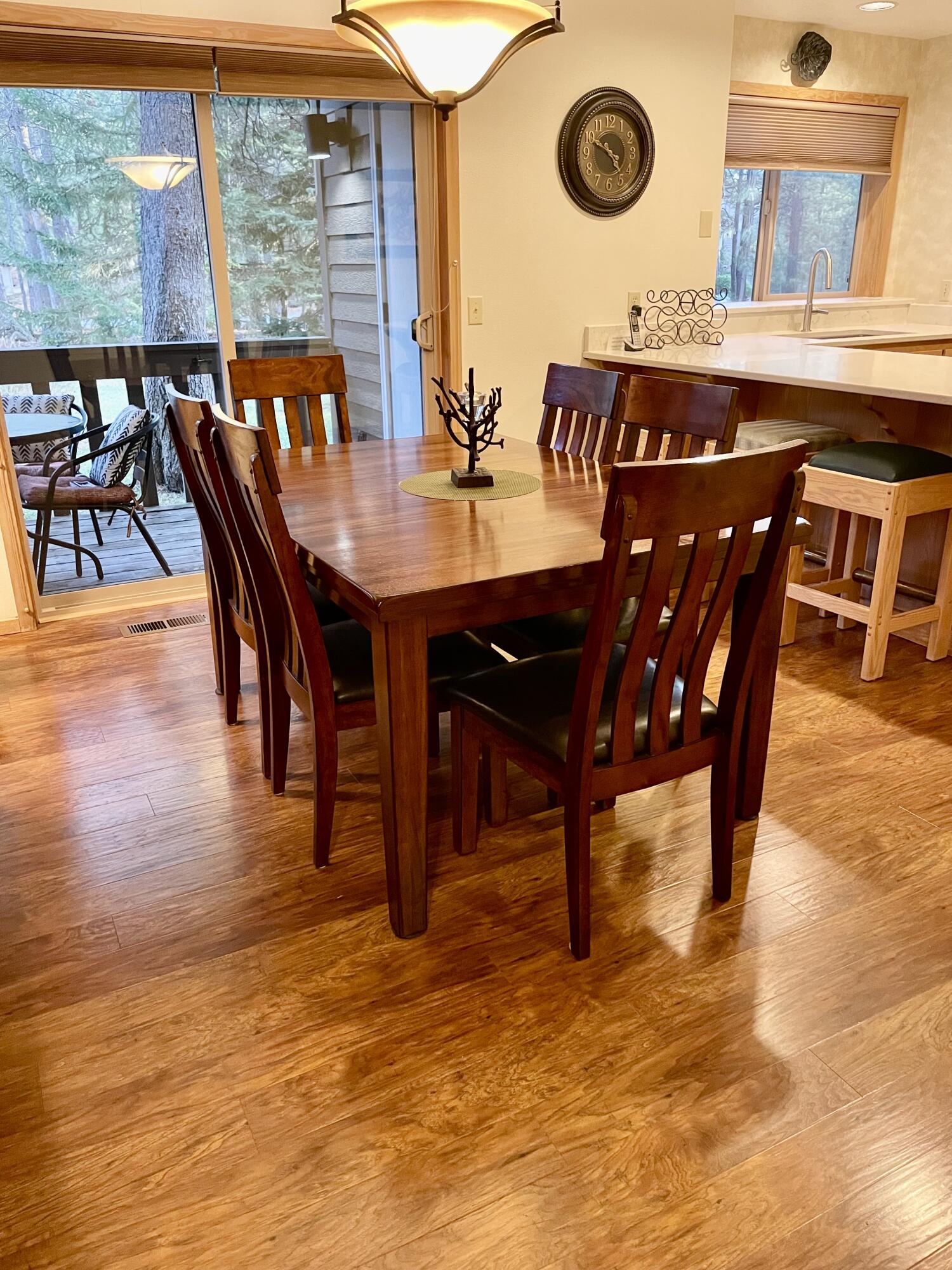 57376 Beaver Ridge Loop, Unit 33C1 Sunriver, OR 97707 - Photo 7 of 35 a view of a dining room with furniture and wooden floor