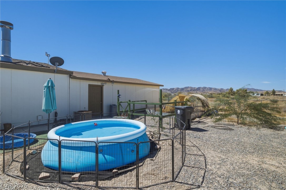 2380 West Simkins Road Pahrump, NV 89060 - Photo 31 of 38 Rugged desert hills provide a scenic background for this private outdoor space.