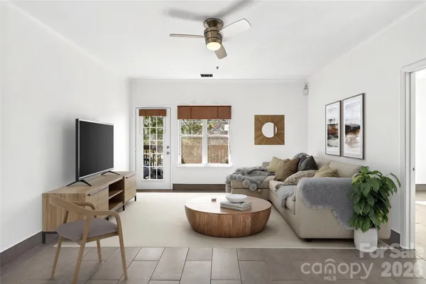 a living room with furniture and a flat screen tv