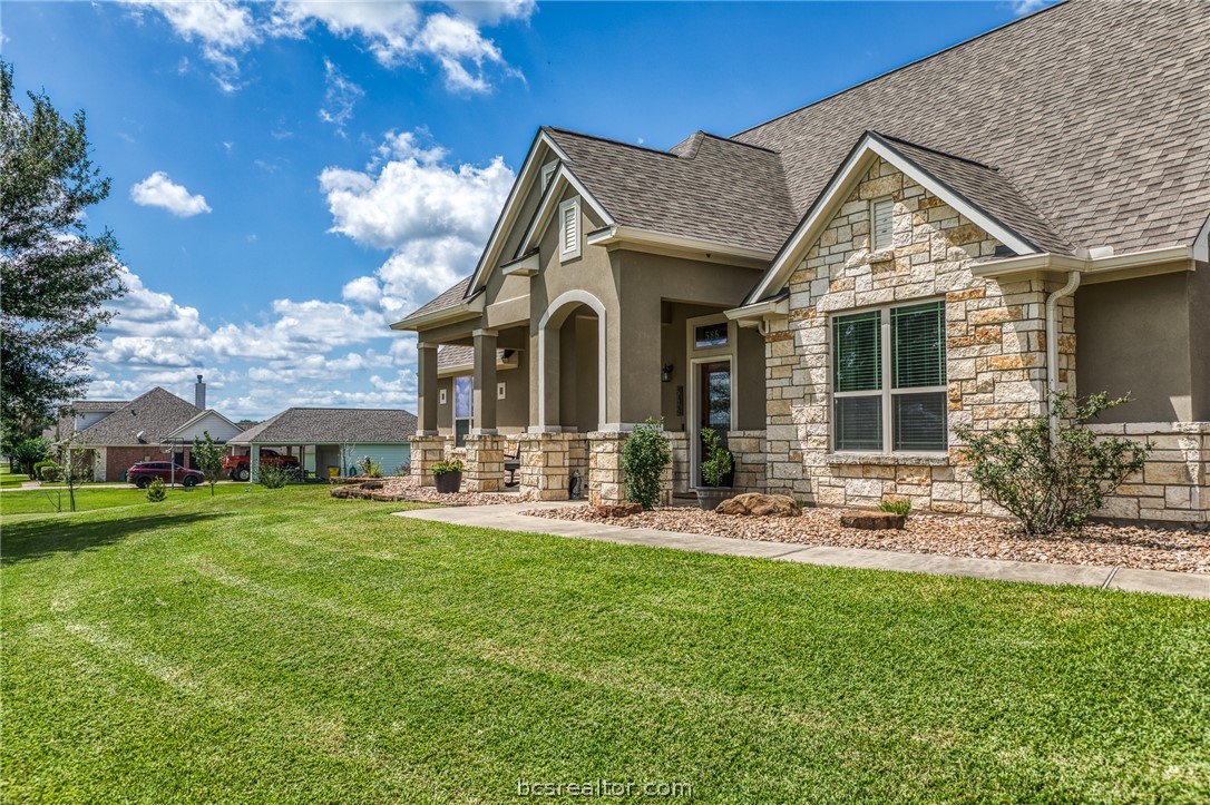 586 Ruby Drive Bellville, TX 77418 - Photo 42 of 50 a front view of a house with a yard