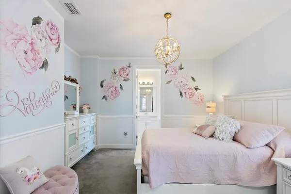a view of a patio with a table and chairs under an umbrella