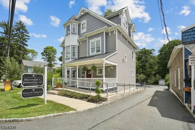 a view of a house with backyard and porch