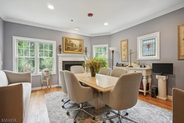 a living room with fireplace furniture and a window
