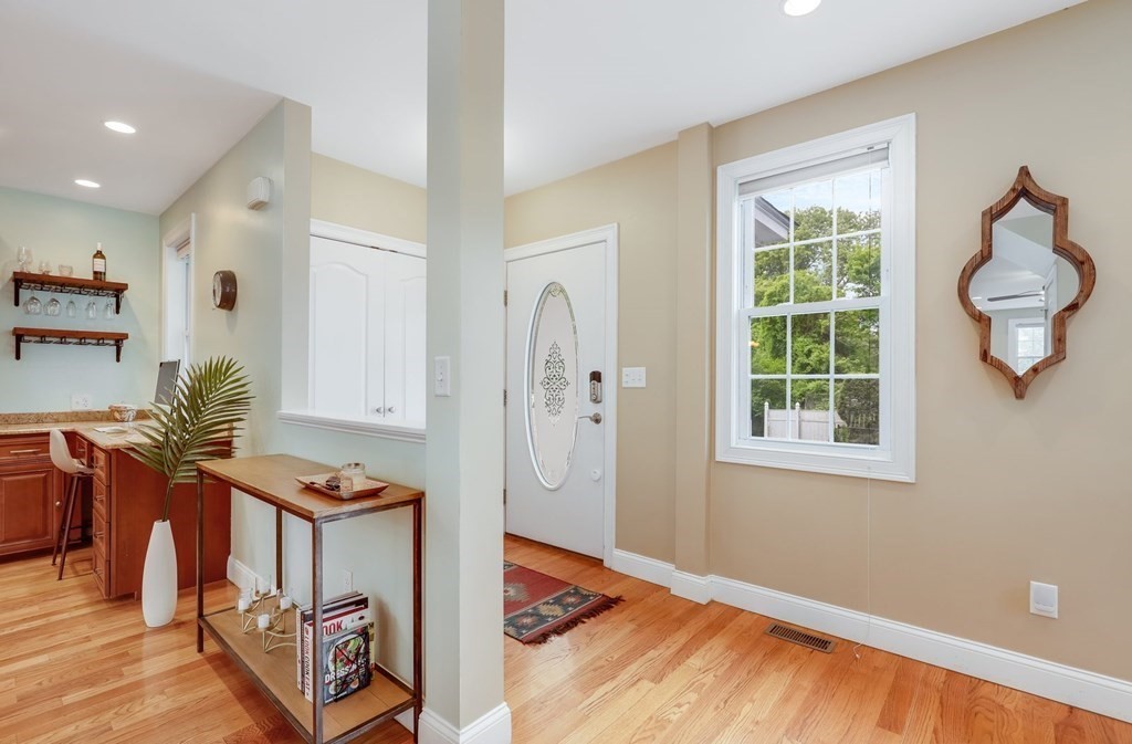 10 Maple Way Wakefield, MA 01880 - Photo 11 of 26 a view of an entryway with wooden floor and a window