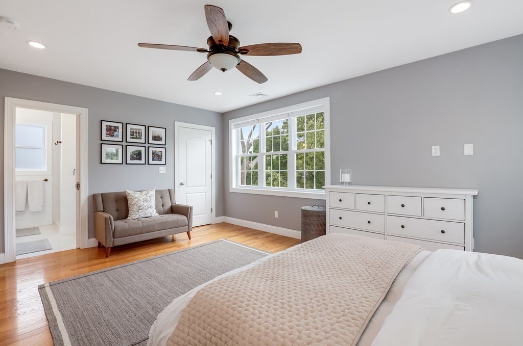 10 Maple Way Wakefield, MA 01880 - Photo 14 of 26 a bedroom with a bed and a couch