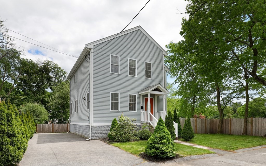 10 Maple Way Wakefield, MA 01880 - Photo 2 of 26 a front view of a house with garden