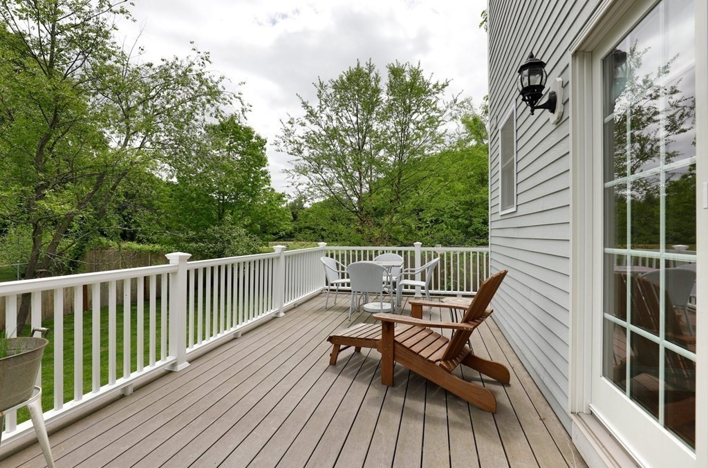 10 Maple Way Wakefield, MA 01880 - Photo 23 of 26 a view of a roof deck with wooden floor and fence