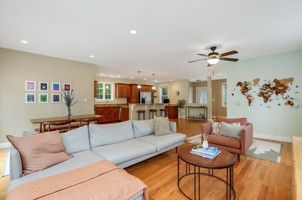10 Maple Way Wakefield, MA 01880 - Photo 5 of 26 a living room with furniture and kitchen view