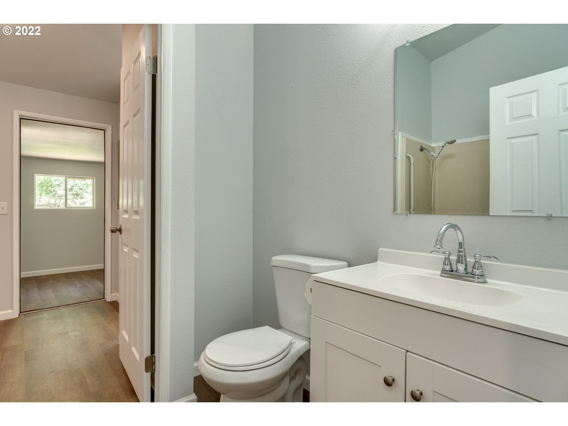 35355 Southeast Surface Road Estacada, OR 97023 - Photo 17 of 32 a bathroom with a sink toilet and vanity
