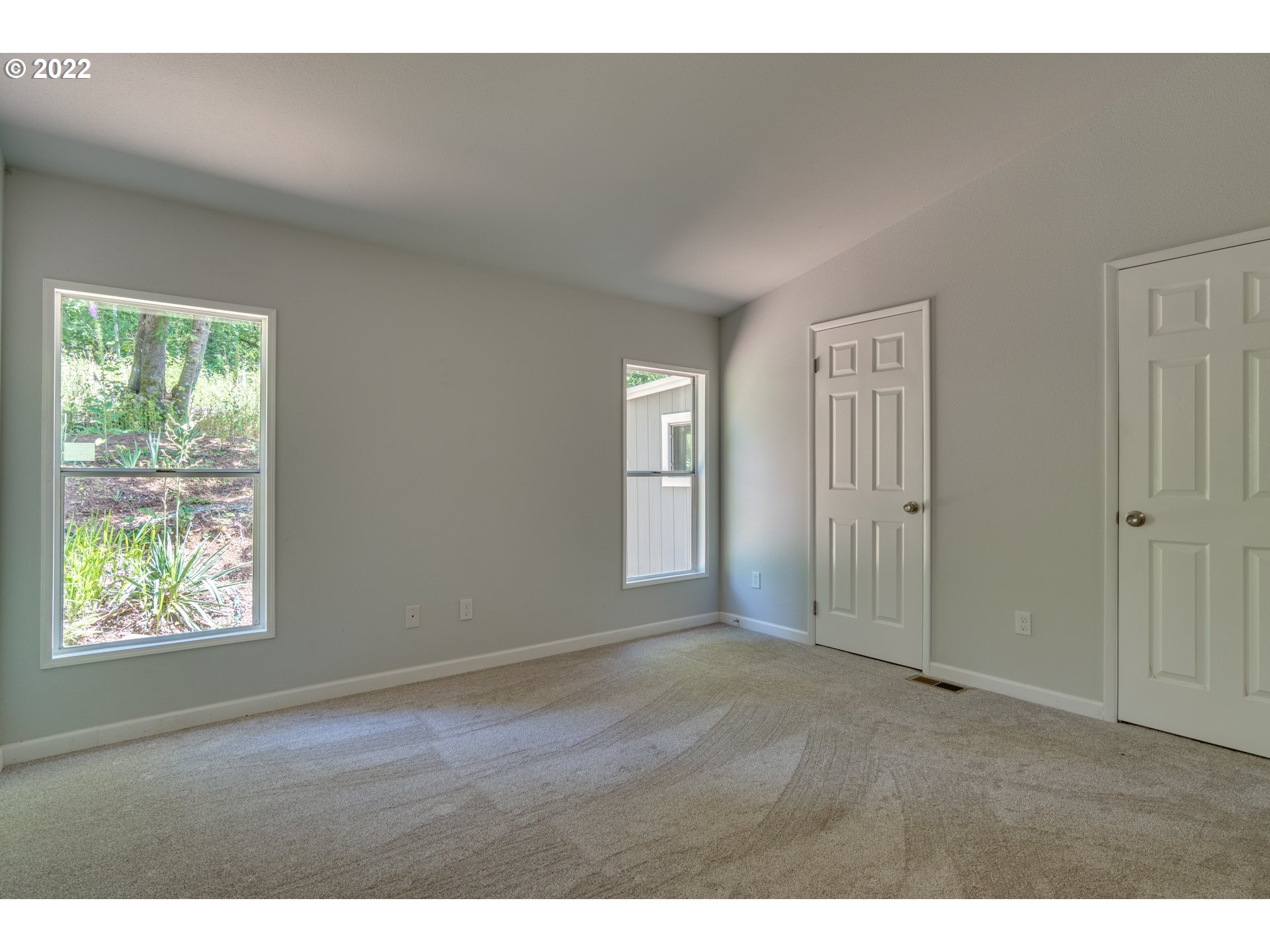 35355 Southeast Surface Road Estacada, OR 97023 - Photo 21 of 32 a view of an empty room with wooden floor and a window