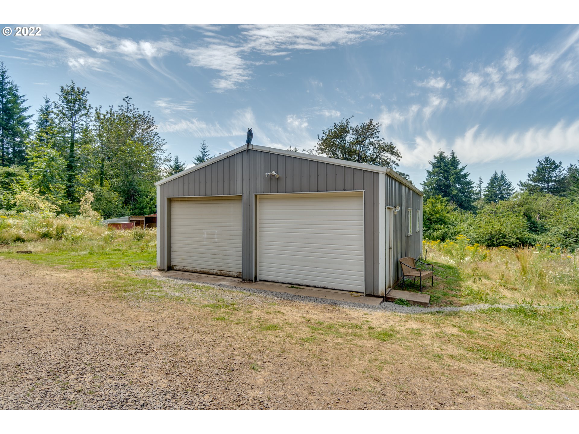 35355 Southeast Surface Road Estacada, OR 97023 - Photo 25 of 32 a house with green field in front of it