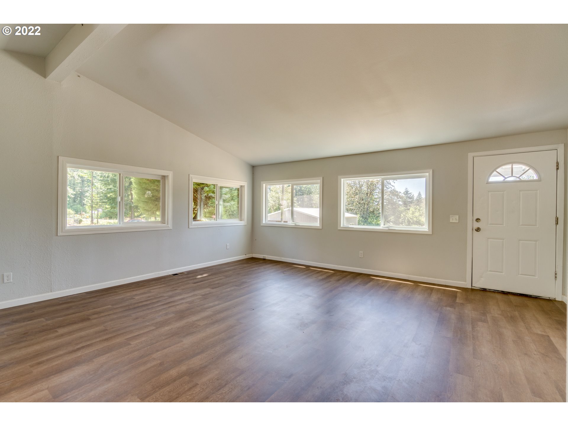 35355 Southeast Surface Road Estacada, OR 97023 - Photo 5 of 32 a view of an empty room with wooden floor and a window