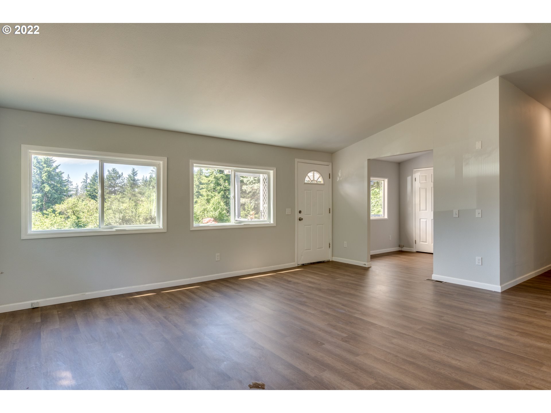 35355 Southeast Surface Road Estacada, OR 97023 - Photo 6 of 32 an empty room with wooden floor and windows