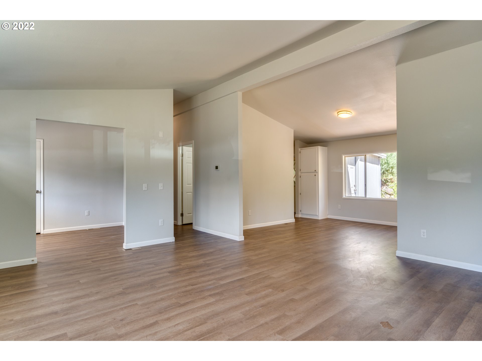35355 Southeast Surface Road Estacada, OR 97023 - Photo 7 of 32 a view of an empty room and window and wooden floor