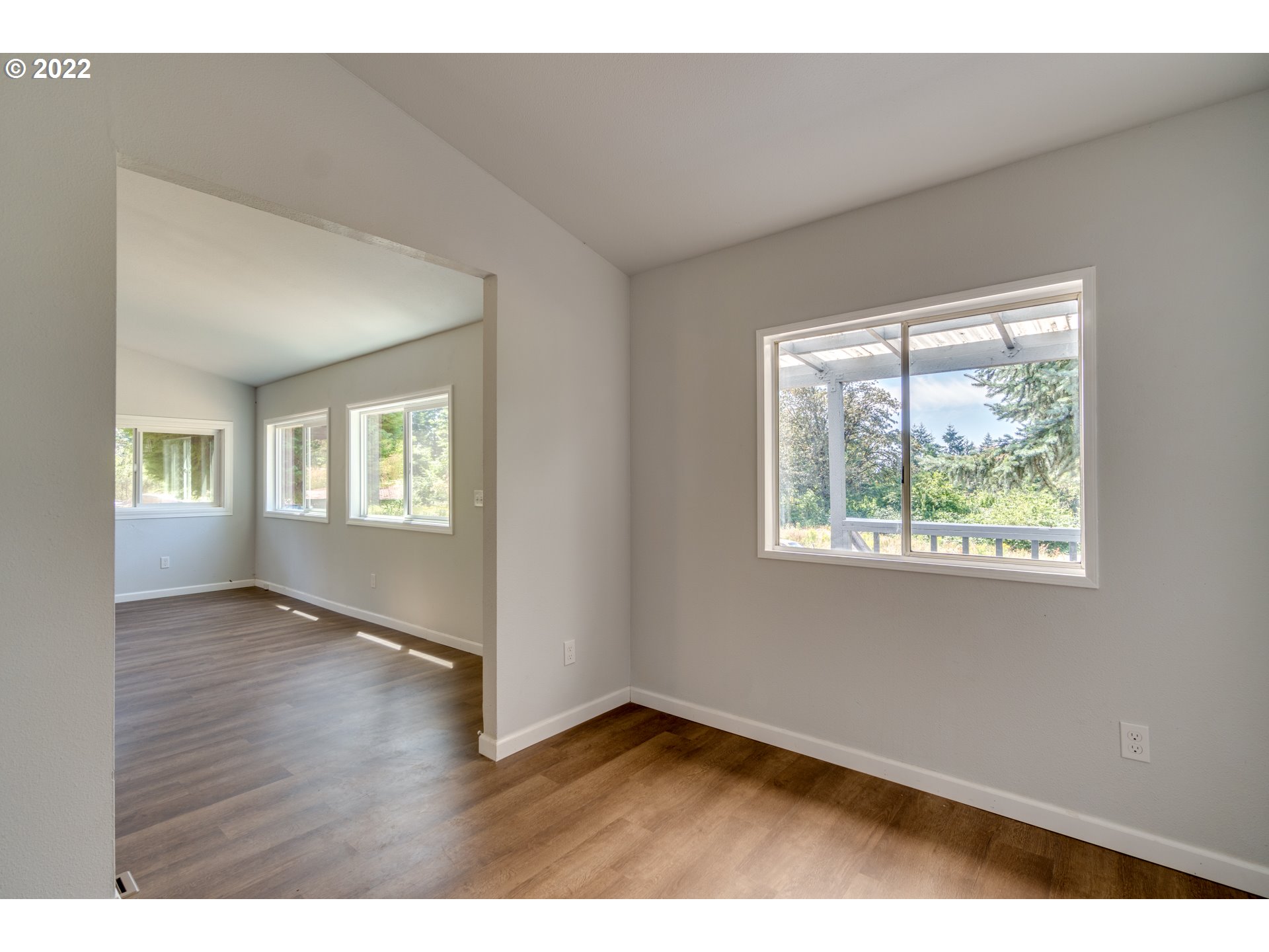 35355 Southeast Surface Road Estacada, OR 97023 - Photo 8 of 32 a view of an empty room with wooden floor and a window