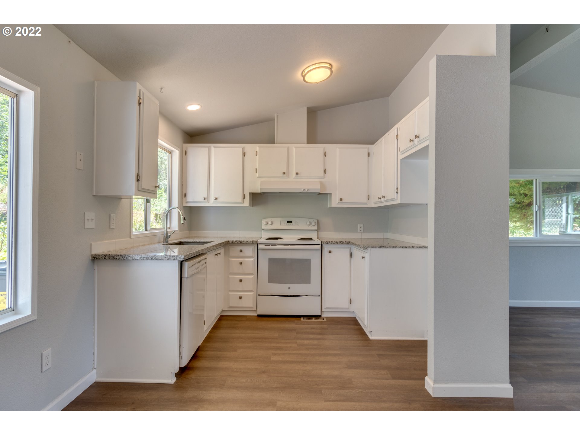 35355 Southeast Surface Road Estacada, OR 97023 - Photo 10 of 32 a kitchen with granite countertop white cabinets and white appliances