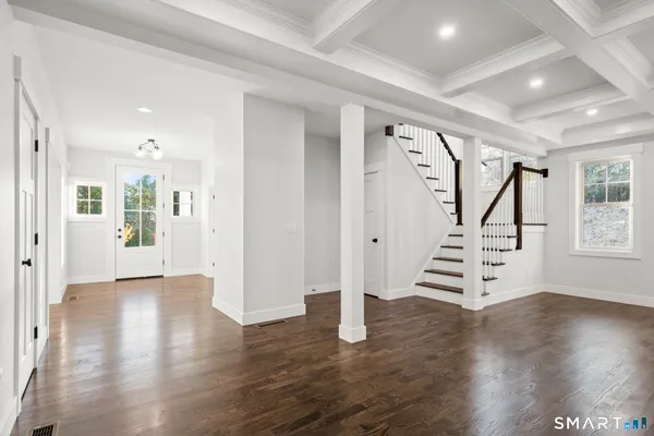 a view of entryway with wooden floor