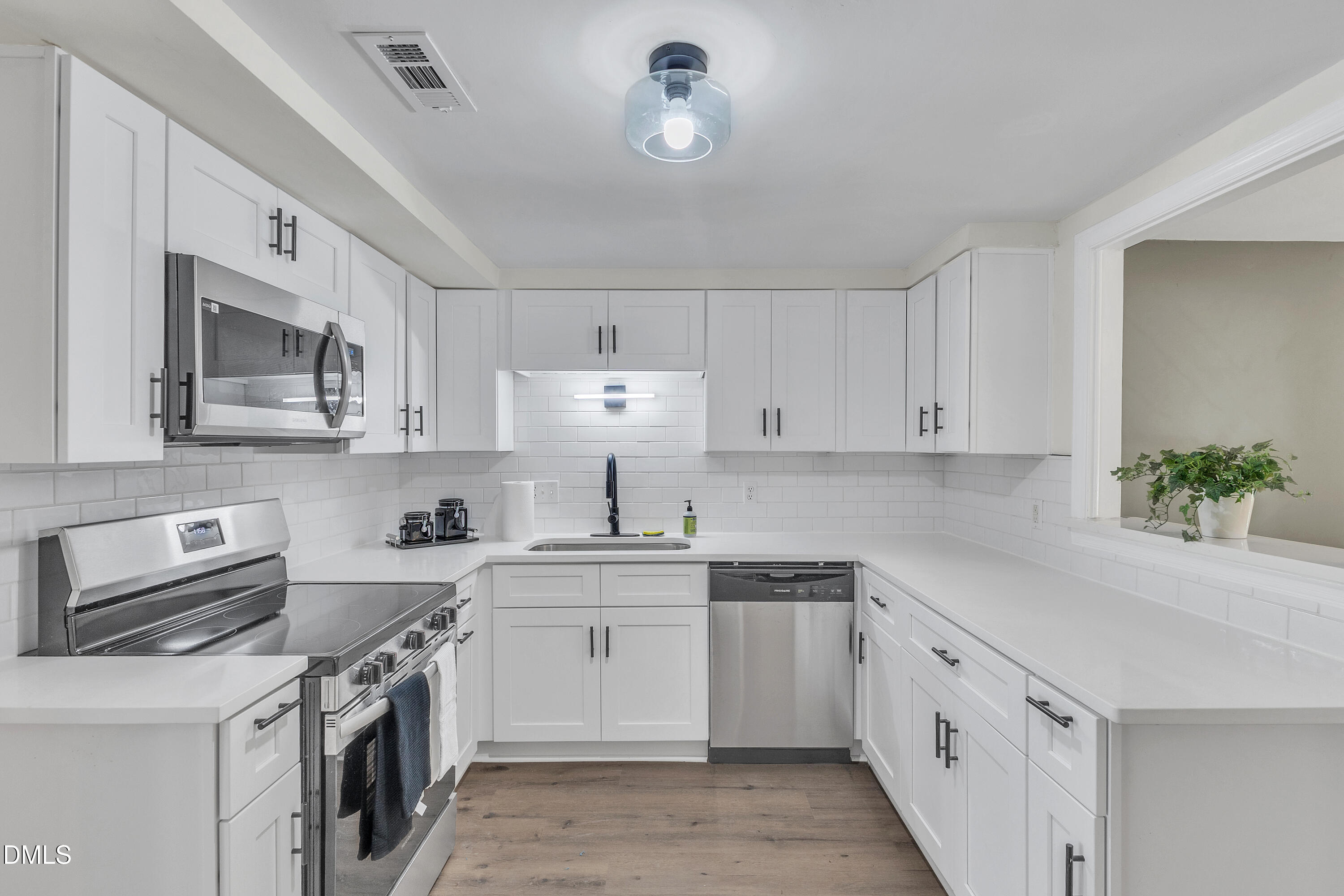 12 Patriot Circle Durham, NC 27704 - Photo 1 of 13 a kitchen with cabinets appliances a sink and a counter space