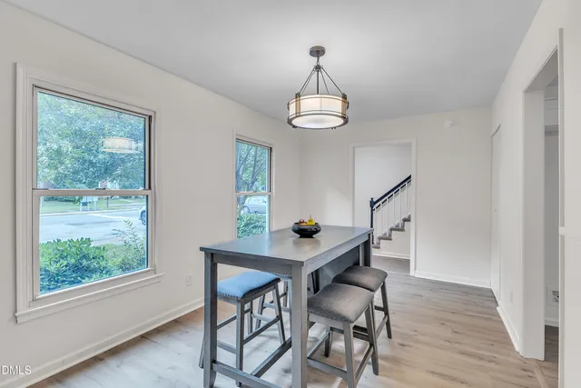 a kitchen with granite countertop wooden cabinets stainless steel appliances and a counter space
