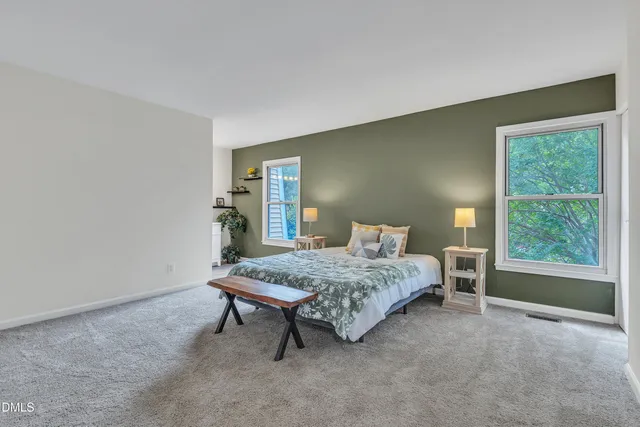 a table room with a wooden floor and a window