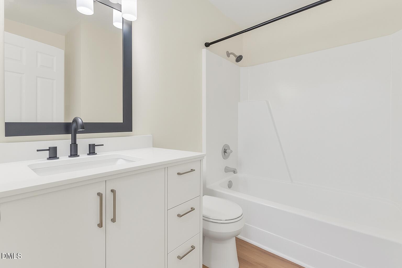 12 Patriot Circle Durham, NC 27704 - Photo 9 of 13 a bathroom with a sink a toilet and shower