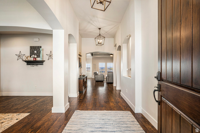 2311 South 1340 West St. George, UT 84770 - Photo 8 of 56 Entrance foyer with dark wood-type flooring, arched walkways, and a high ceiling