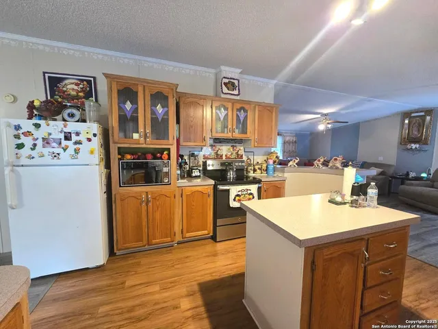 a kitchen with a sink a stove and refrigerator