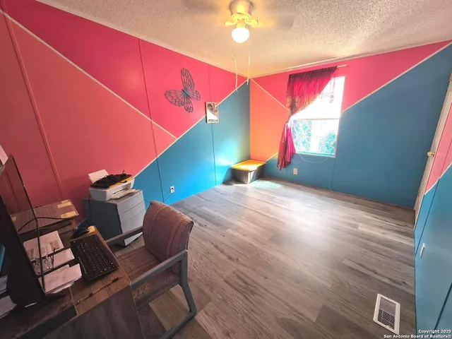 a workspace with furniture and screen