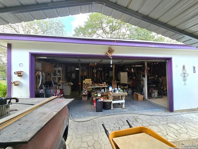 a view of an chairs and window in the patio