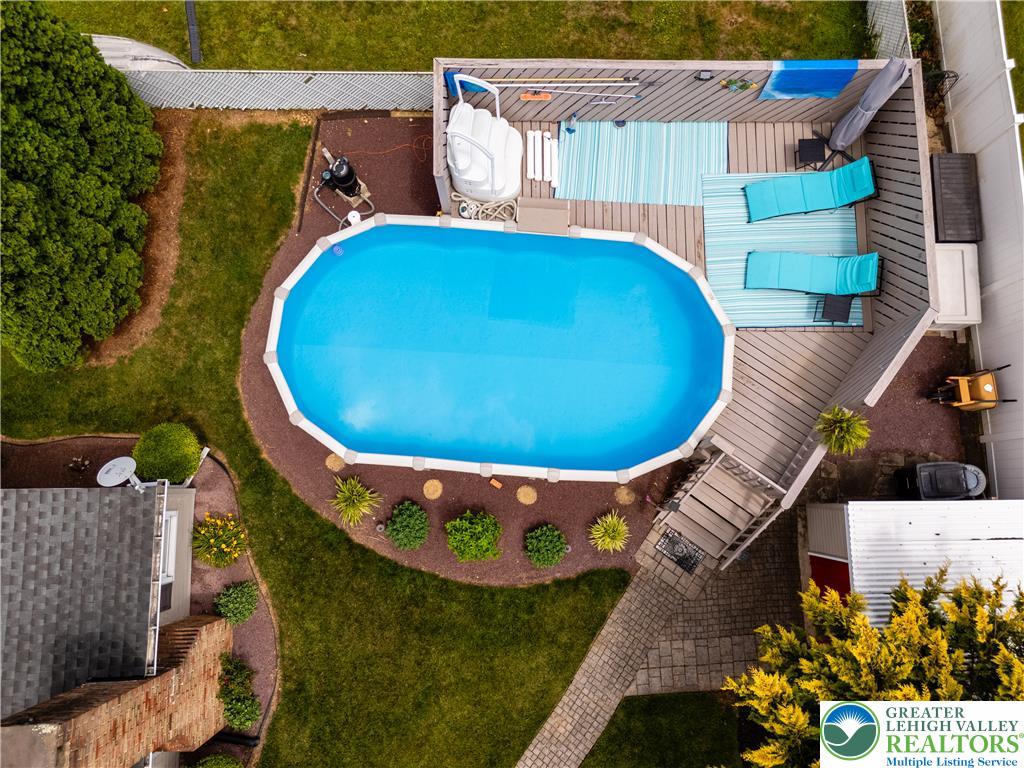 2087 Hopewell Road Bethlehem, PA 18017 - Photo 38 of 38 An inviting backyard oasis offers a sparkling above-ground pool and a spacious wooden deck.