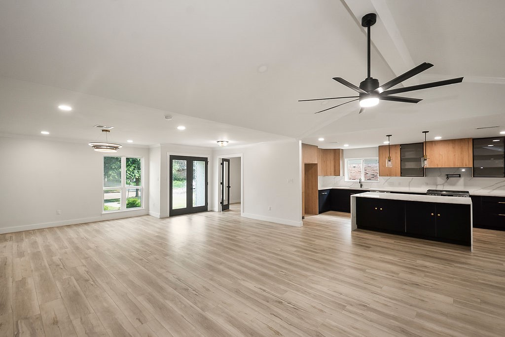 6106 Rutherglenn Drive Houston, TX 77096 - Photo 14 of 41 Open-concept kitchen and living area designed with modern finishes and abundant natural light.