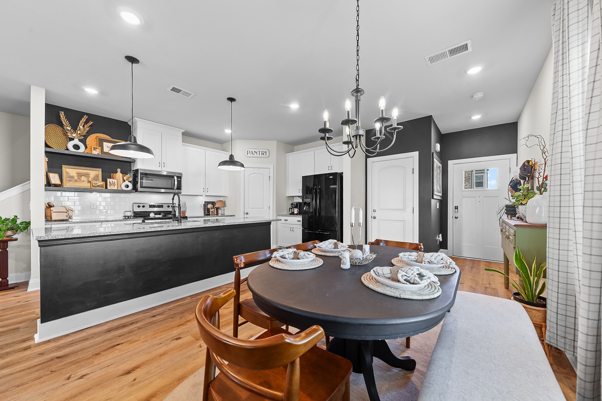 744 Prairie View Drive Columbia, TN 38401 - Photo 13 of 60 a kitchen with stainless steel appliances kitchen island granite countertop a dining table and chairs in it