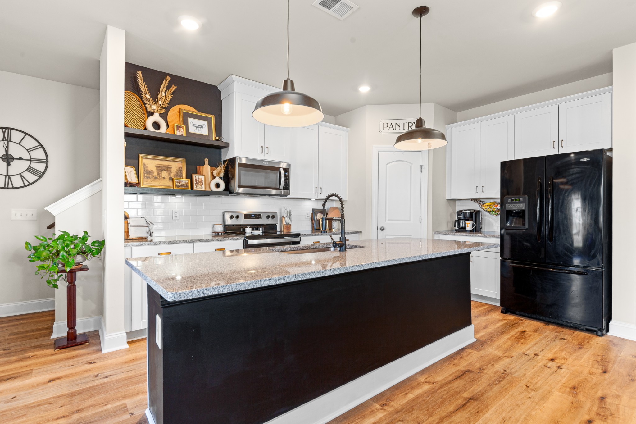 744 Prairie View Drive Columbia, TN 38401 - Photo 20 of 60 a kitchen with stainless steel appliances granite countertop a refrigerator a stove a sink dishwasher and a refrigerator with wooden floor