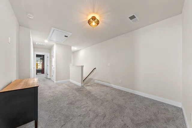 a bed room with a bed and a television