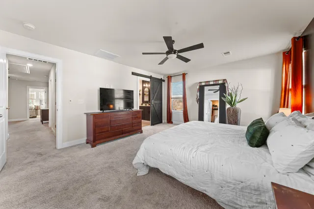 a spacious bathroom with a double vanity sink and a mirror