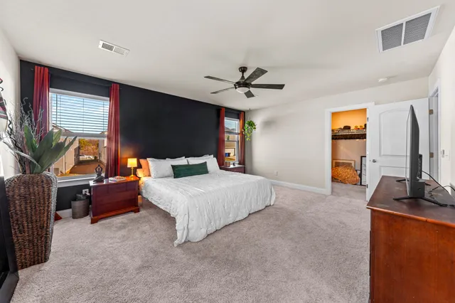 a en suite bathroom with a sink a mirror and shower