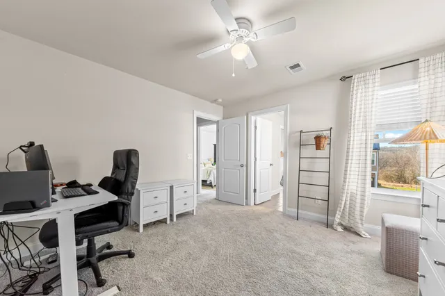 an aerial view of a house with outdoor space