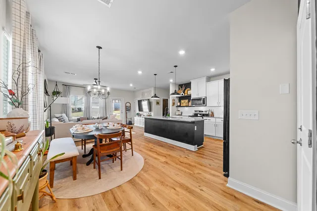 a dining room with furniture and window