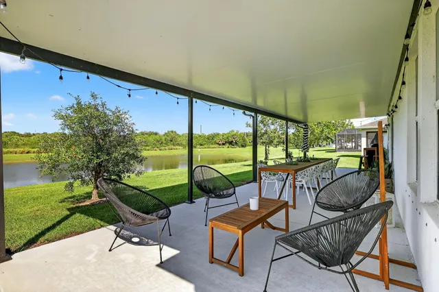 a view of an chairs and tables in the patio